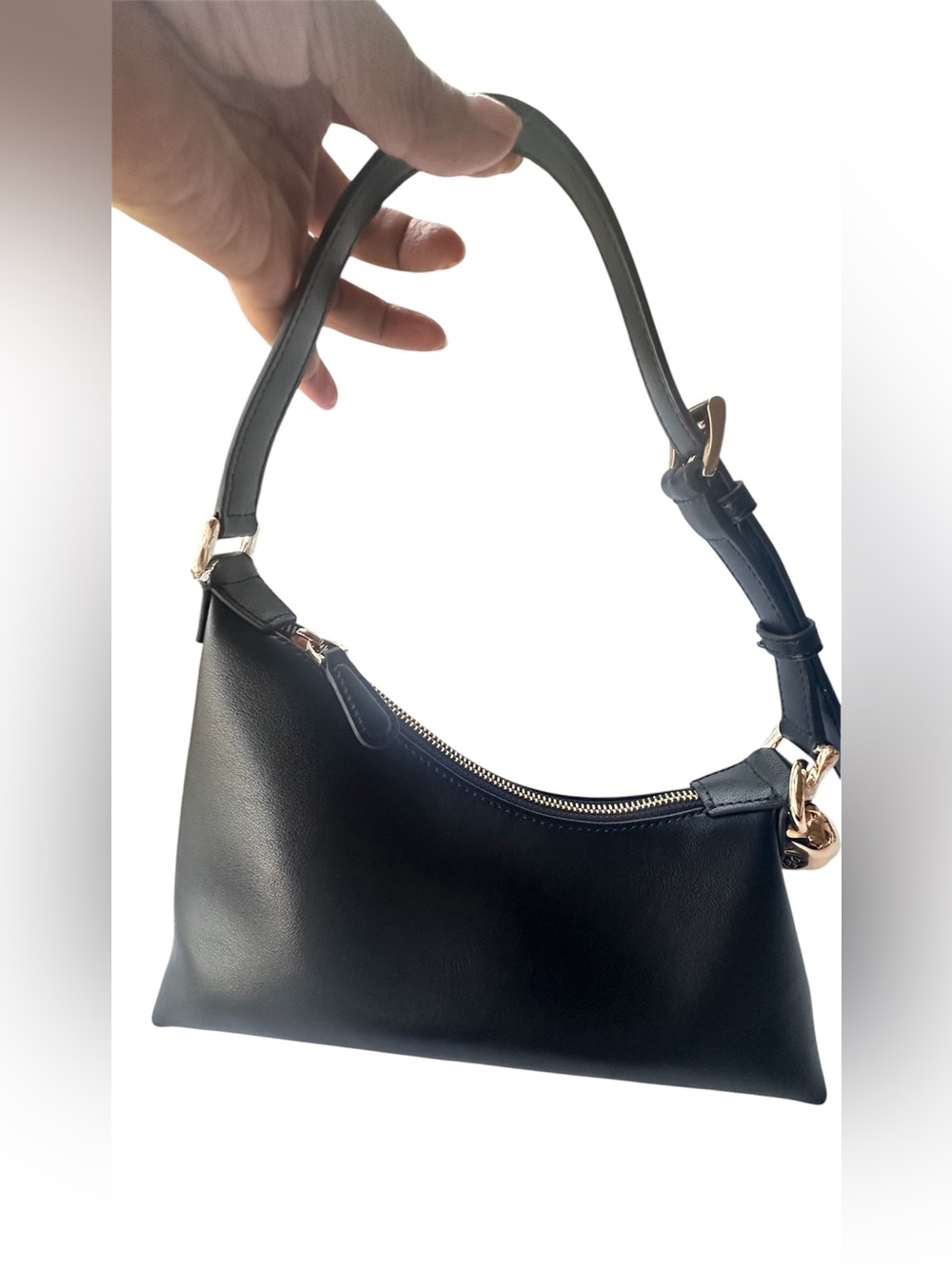 Aupen black leather shoulder bag with gold-tone charm.